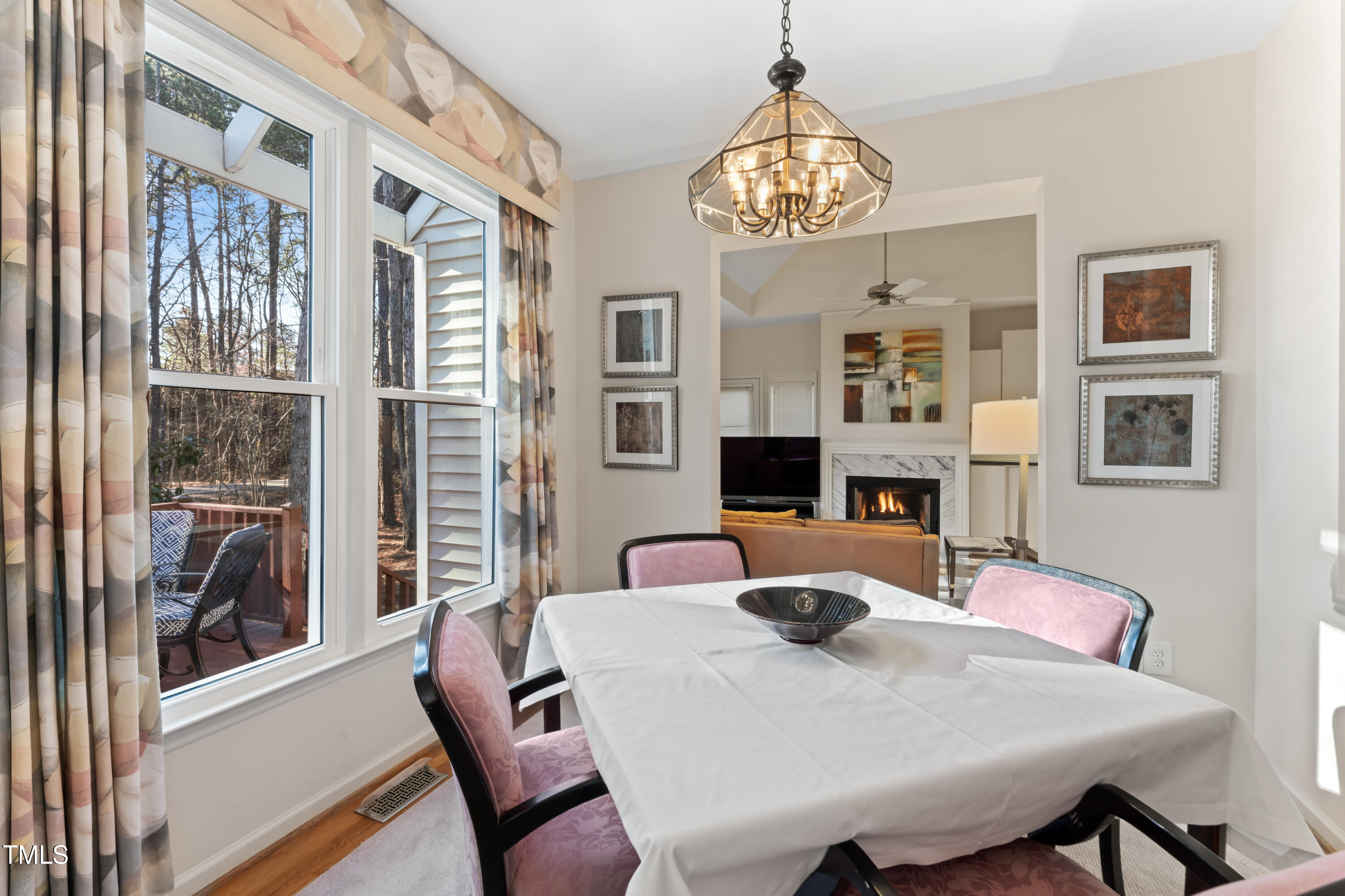 111 Legacy Lane Durham, NC 27713 - Photo 9 of 24 a view of a dining room with furniture large windows and wooden floor
