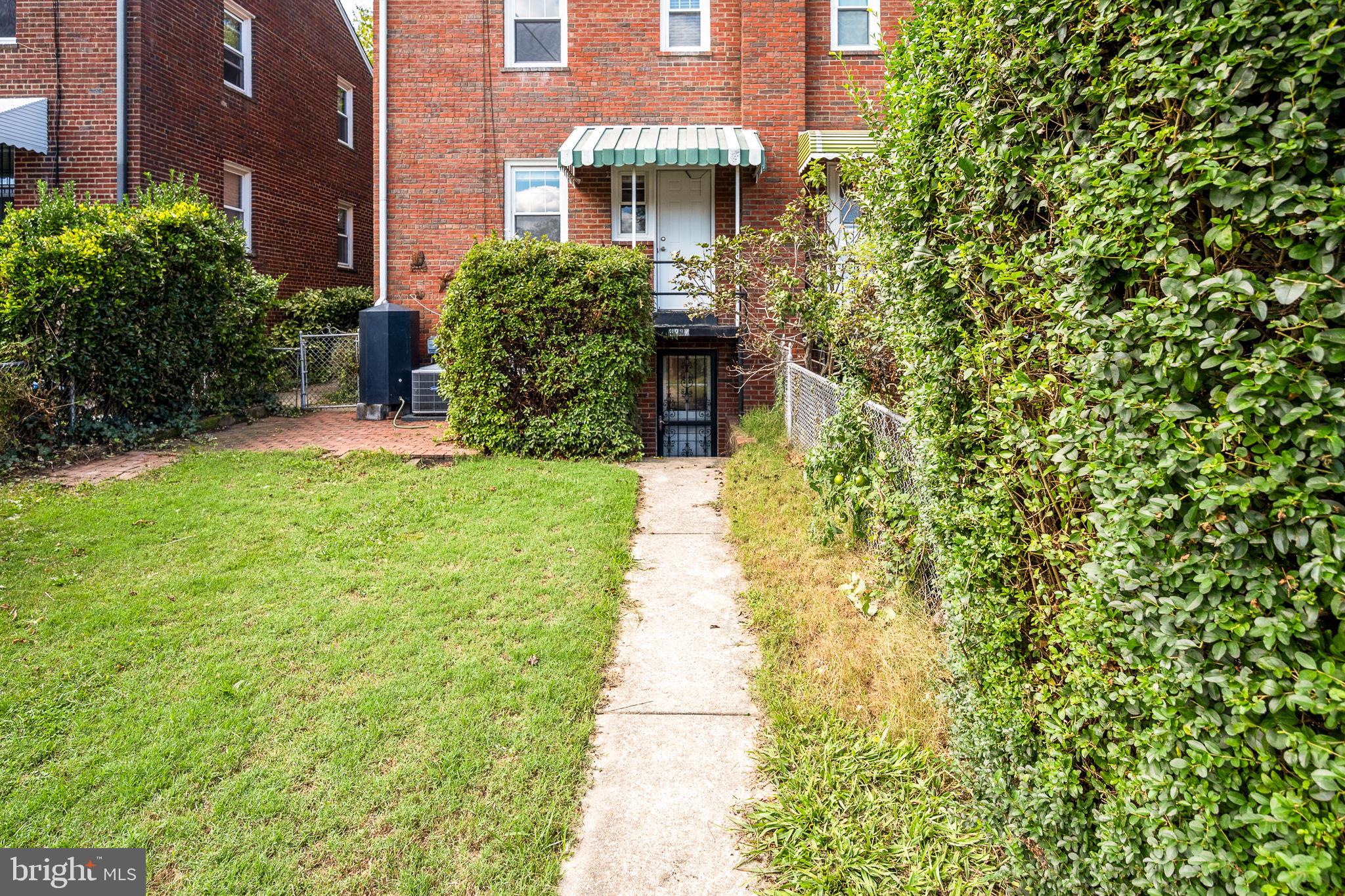 4937 11th Street Northeast Washington, DC 20017 - Photo 27 of 28 a front view of a house with garden