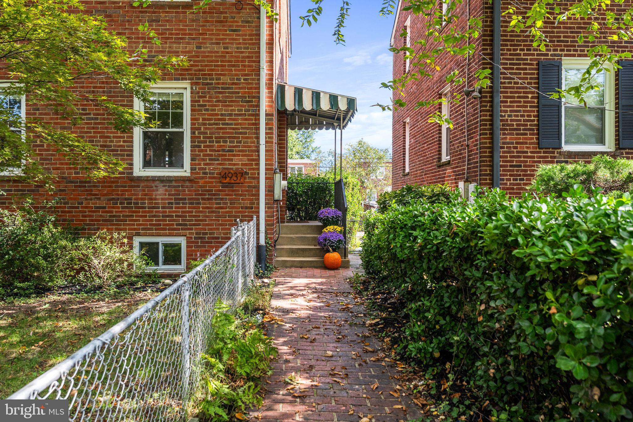 4937 11th Street Northeast Washington, DC 20017 - Photo 3 of 28 a view of a pathway both side of house