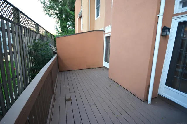 a view of balcony with wooden floor