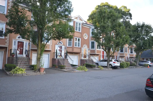 a city street lined with buildings and cars