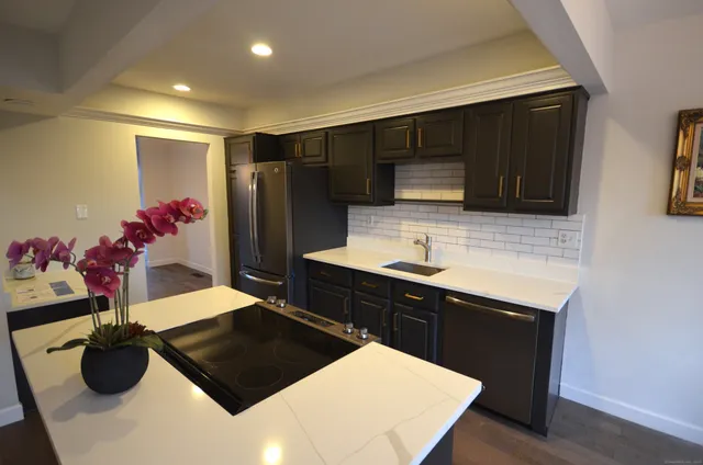 a kitchen with a sink and cabinets