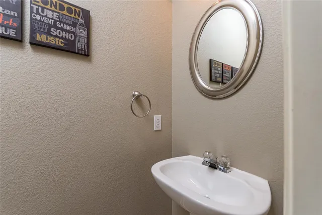 a view of a dining room with furniture and a chandelier