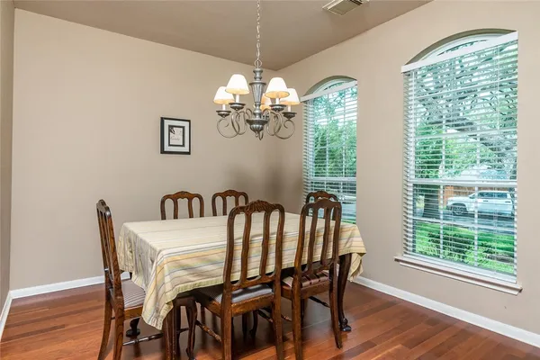 a view of a dining room with furniture and window