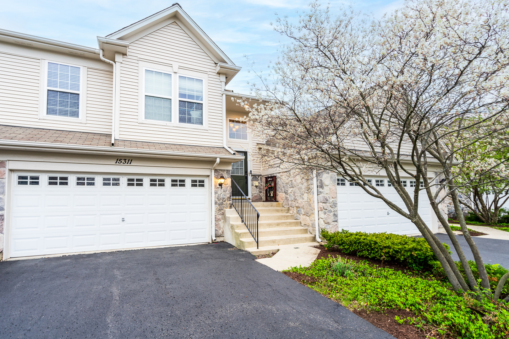 15311 Pinewood Road, Unit 15311 Lockport, IL 60441 - Photo 1 of 17 a view of a house with a yard and garage