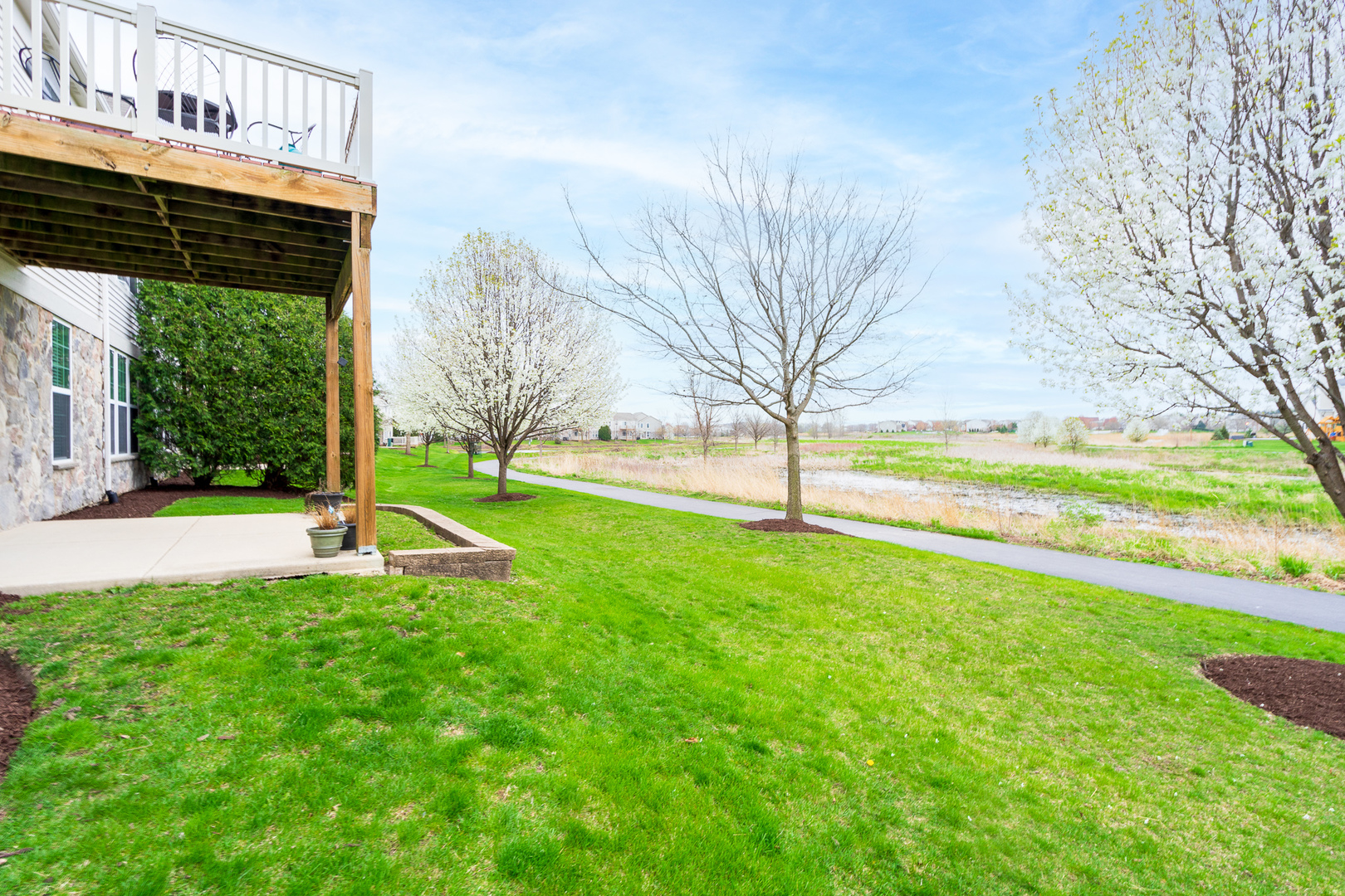 15311 Pinewood Road, Unit 15311 Lockport, IL 60441 - Photo 15 of 17 a view of yard with swimming pool and green space