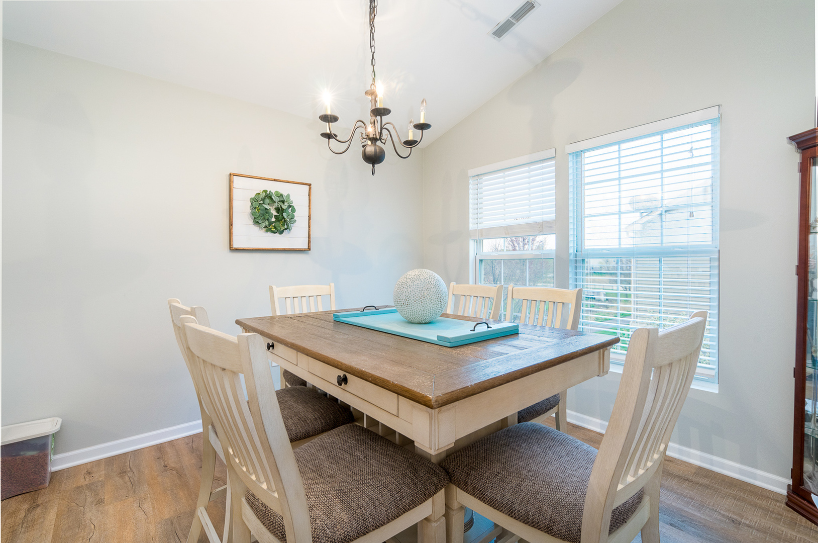15311 Pinewood Road, Unit 15311 Lockport, IL 60441 - Photo 4 of 17 a view of a dining room with furniture window and wooden floor