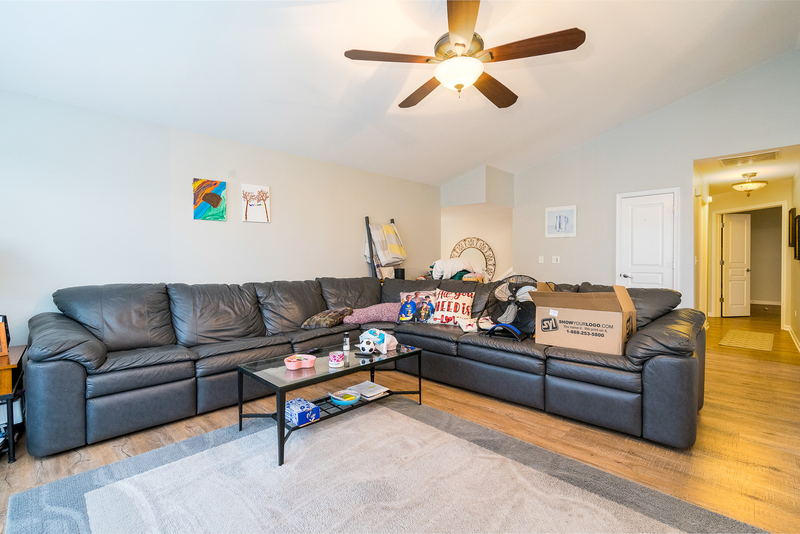 15311 Pinewood Road, Unit 15311 Lockport, IL 60441 - Photo 5 of 17 a living room with furniture and a ceiling fan