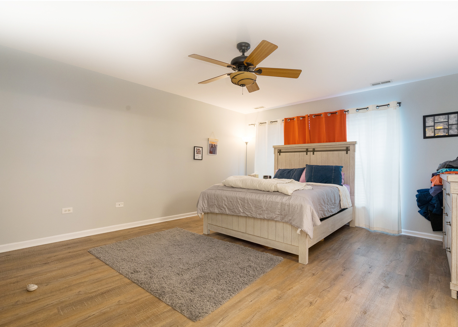 15311 Pinewood Road, Unit 15311 Lockport, IL 60441 - Photo 7 of 17 a bedroom with a bed and a chandelier