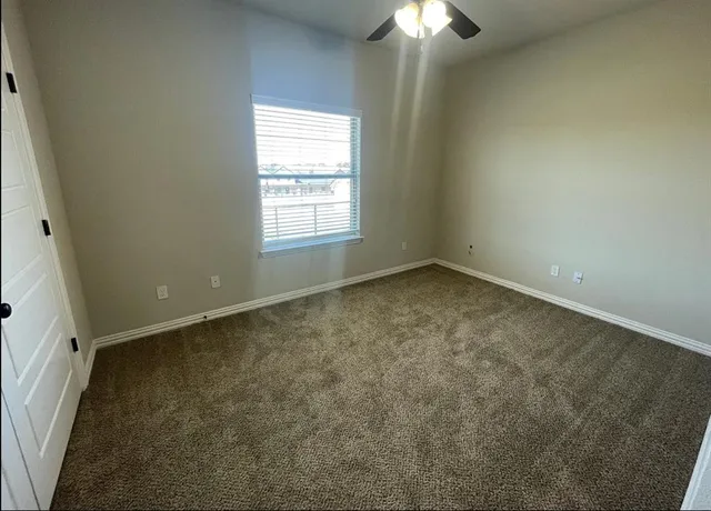 an empty room with a empty space and a window