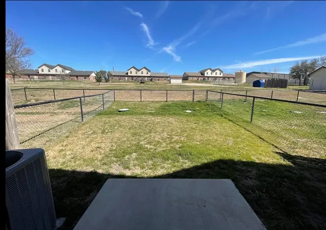 a view of a swimming pool and an outdoor seating