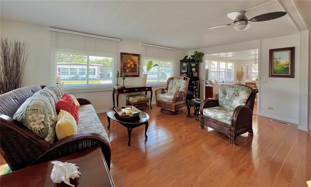 1100 South Belcher Road, Unit 245 Largo, FL 33771 - Photo 11 of 69 a living room with furniture and a wooden floor