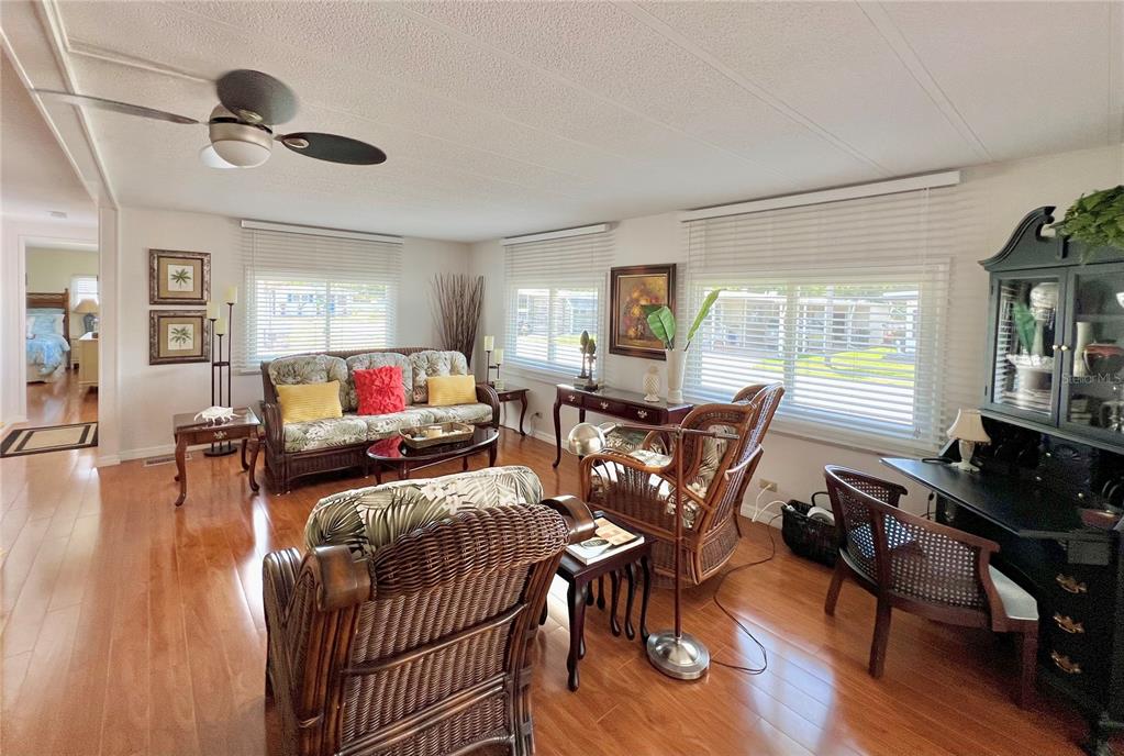1100 South Belcher Road, Unit 245 Largo, FL 33771 - Photo 12 of 69 a living room with furniture and a wooden floor