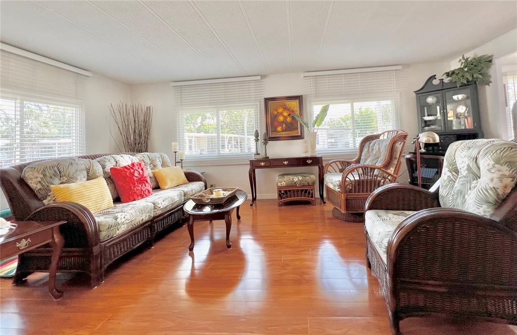 1100 South Belcher Road, Unit 245 Largo, FL 33771 - Photo 15 of 69 a living room with furniture or couch and a wooden floor