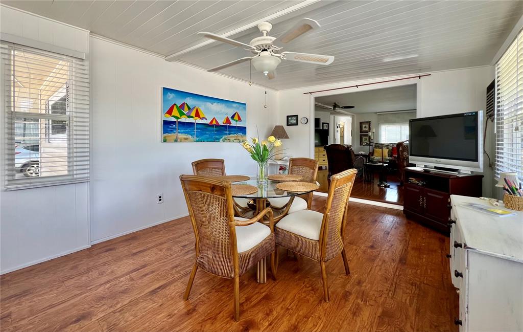 1100 South Belcher Road, Unit 245 Largo, FL 33771 - Photo 18 of 69 a view of a dining room with furniture window and wooden floor
