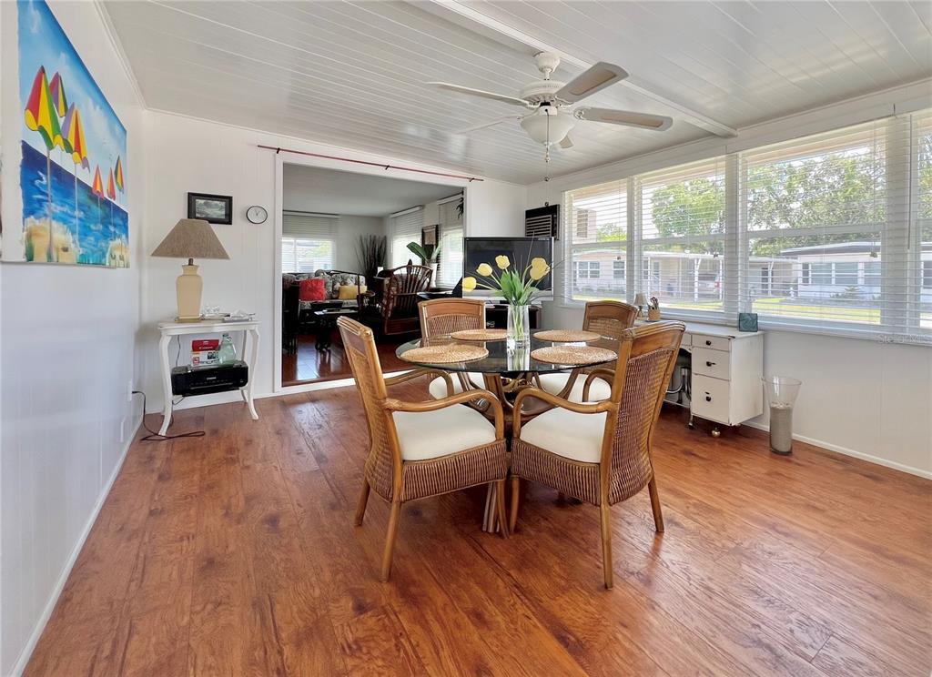 1100 South Belcher Road, Unit 245 Largo, FL 33771 - Photo 19 of 69 a view of a dining room with furniture window and wooden floor