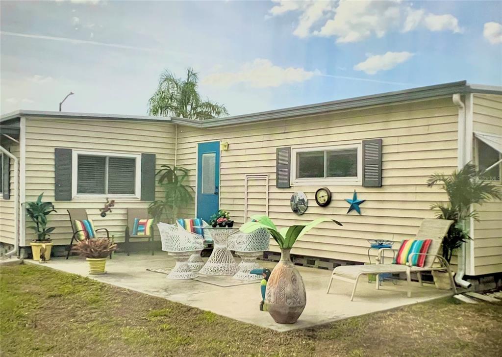 1100 South Belcher Road, Unit 245 Largo, FL 33771 - Photo 2 of 69 a view of a dinning table and chair in the patio