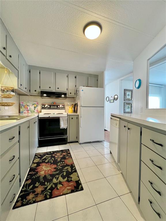 1100 South Belcher Road, Unit 245 Largo, FL 33771 - Photo 22 of 69 a kitchen with sink cabinets and stainless steel appliances