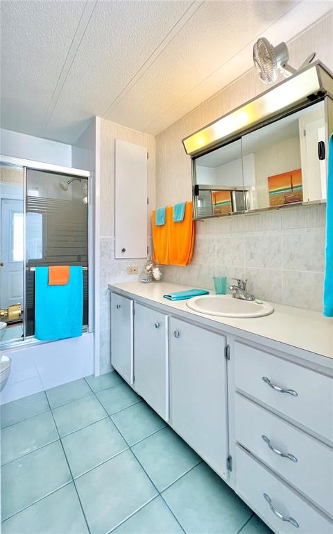 1100 South Belcher Road, Unit 245 Largo, FL 33771 - Photo 30 of 69 a spacious bathroom with a sink and a mirror