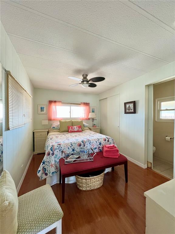 1100 South Belcher Road, Unit 245 Largo, FL 33771 - Photo 32 of 69 a bedroom with a bed and a table in it