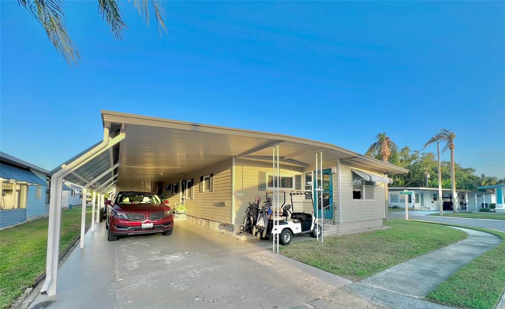 1100 South Belcher Road, Unit 245 Largo, FL 33771 - Photo 36 of 69 a view of a car park in front of house