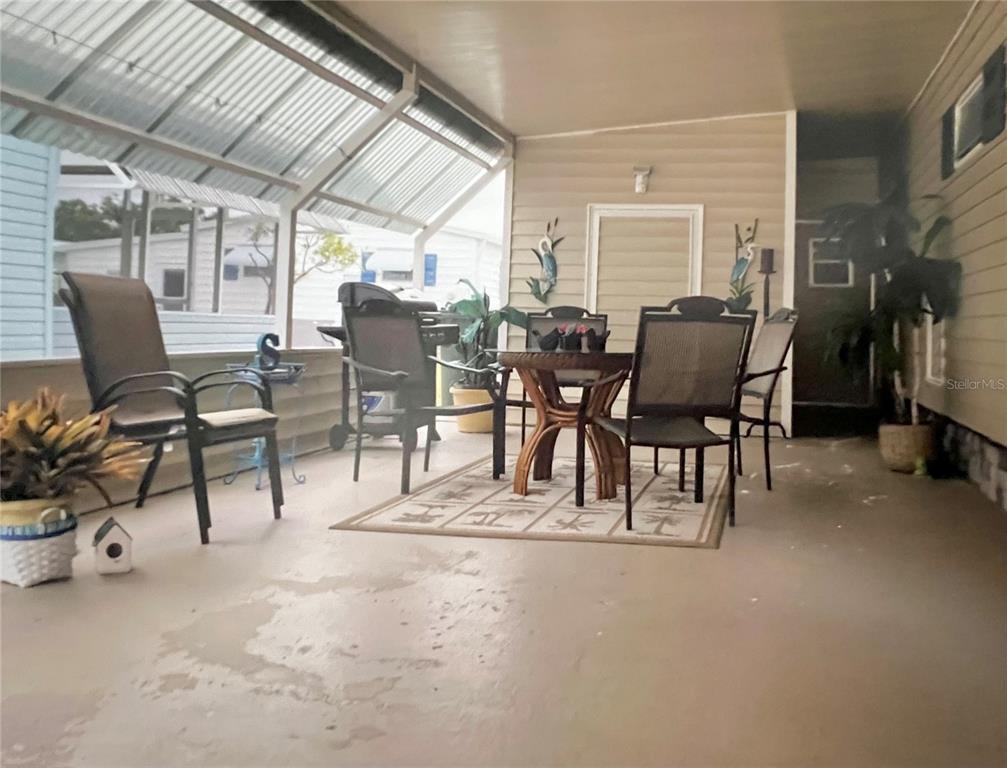 1100 South Belcher Road, Unit 245 Largo, FL 33771 - Photo 5 of 69 a view of a dining room with furniture window and outside view