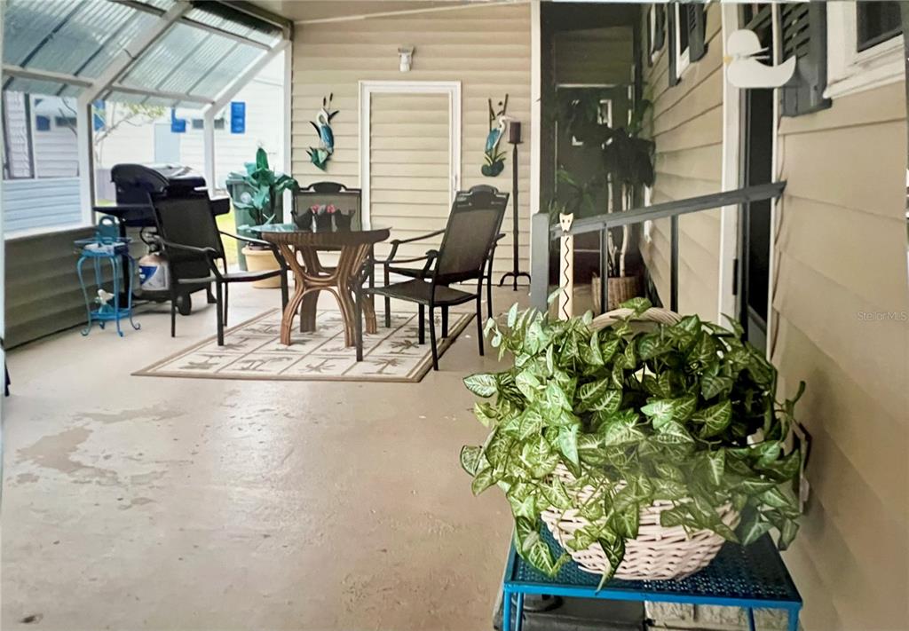 1100 South Belcher Road, Unit 245 Largo, FL 33771 - Photo 6 of 69 a view of a chairs and table in a patio