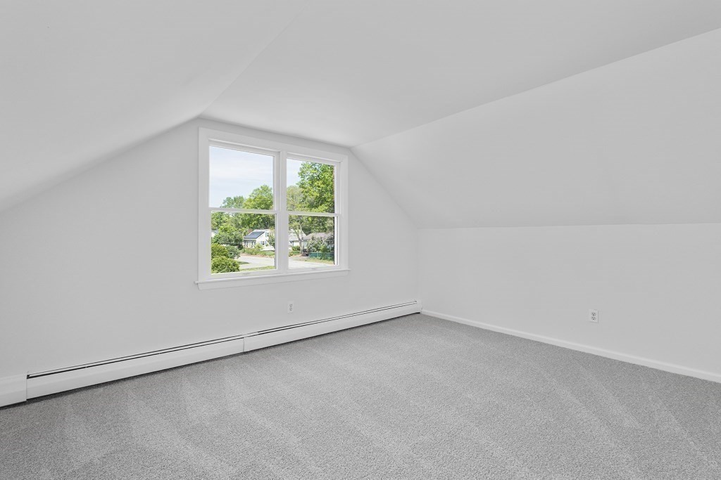 117 Oak Ridge Drive Ayer, MA 01432 - Photo 19 of 26 an empty room with a window