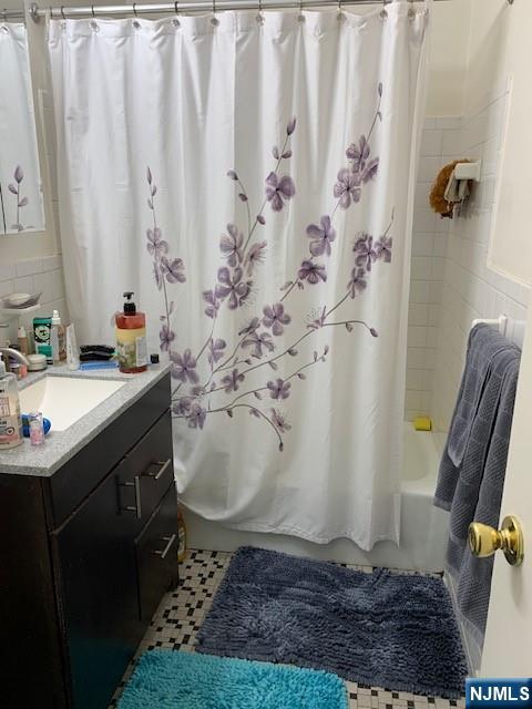 39 East 39th Street, Unit 1E Paterson, NJ 07514 - Photo 13 of 18 a bathroom with a sink and toilet