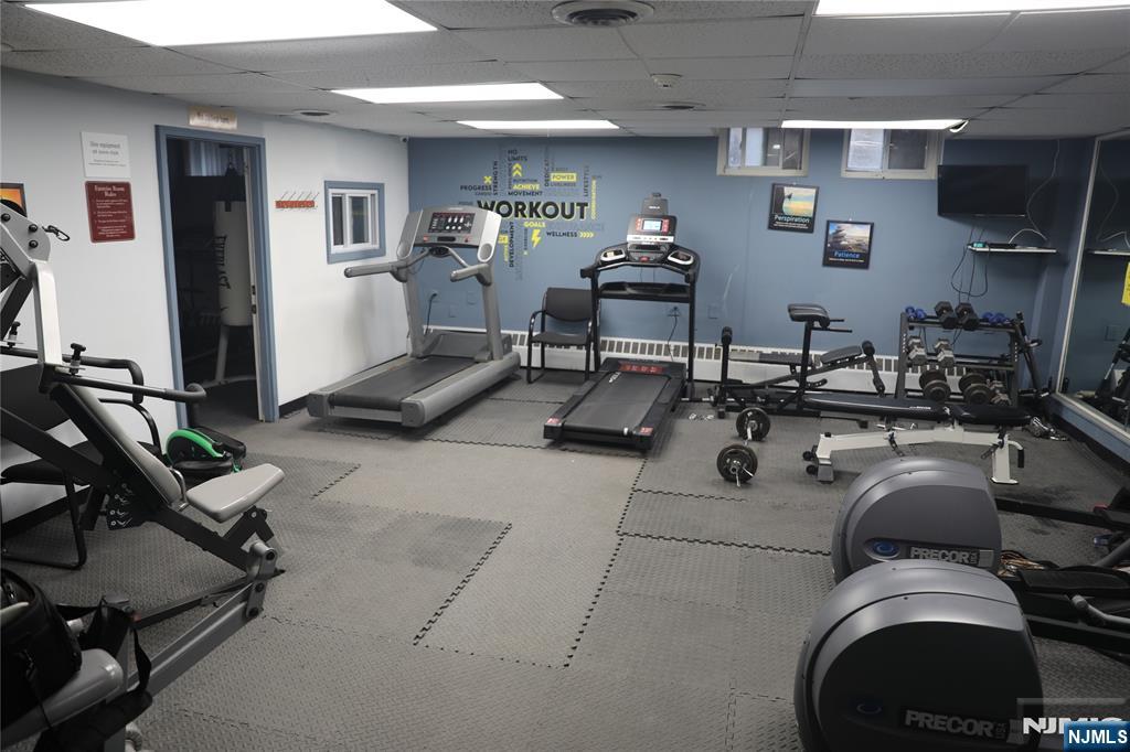 39 East 39th Street, Unit 1E Paterson, NJ 07514 - Photo 14 of 18 a gym hall with exercise machine