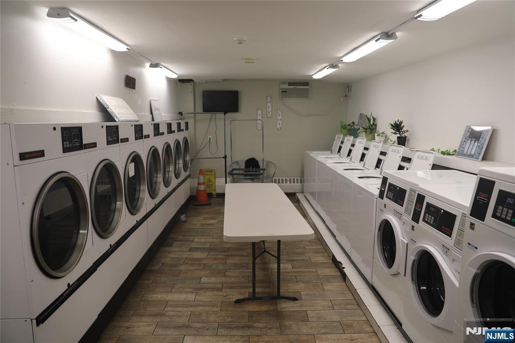 39 East 39th Street, Unit 1E Paterson, NJ 07514 - Photo 15 of 18 a utility room with dryer and washer
