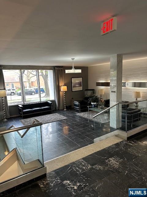 39 East 39th Street, Unit 1E Paterson, NJ 07514 - Photo 17 of 18 a kitchen with stainless steel appliances a stove a sink and a microwave