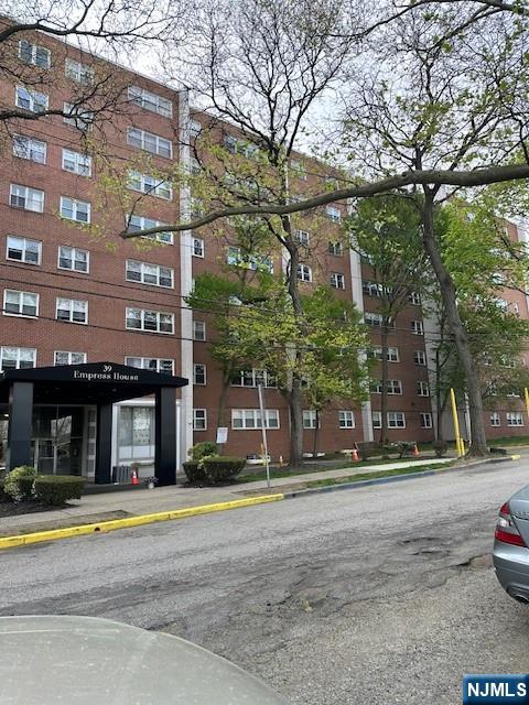 39 East 39th Street, Unit 1E Paterson, NJ 07514 - Photo 18 of 18 a building with trees in front of it