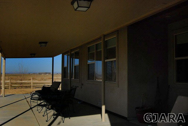 1677 P Road Loma, CO 81524 - Photo 11 of 14 a view of a balcony with chairs and a table