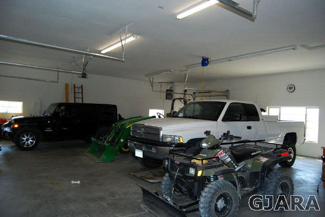 1677 P Road Loma, CO 81524 - Photo 12 of 14 a car parked in a garage