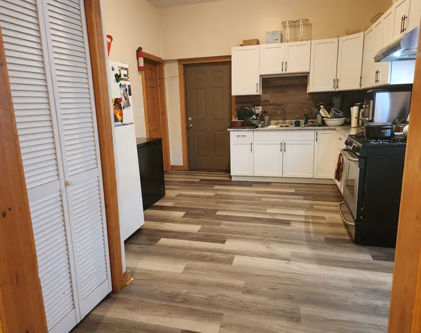 a view of a kitchen with a sink