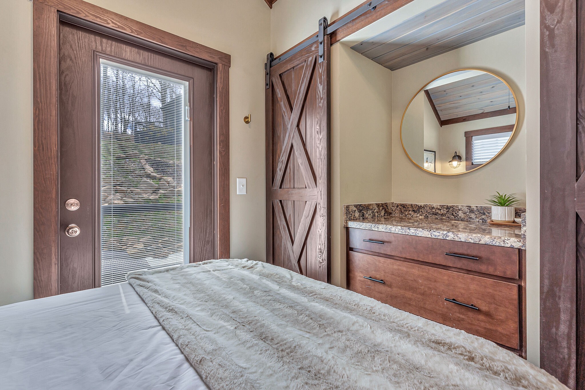 42 Oakleaf Trail Tracy City, TN 37387 - Photo 23 of 73 a bedroom with a bed and a mirror