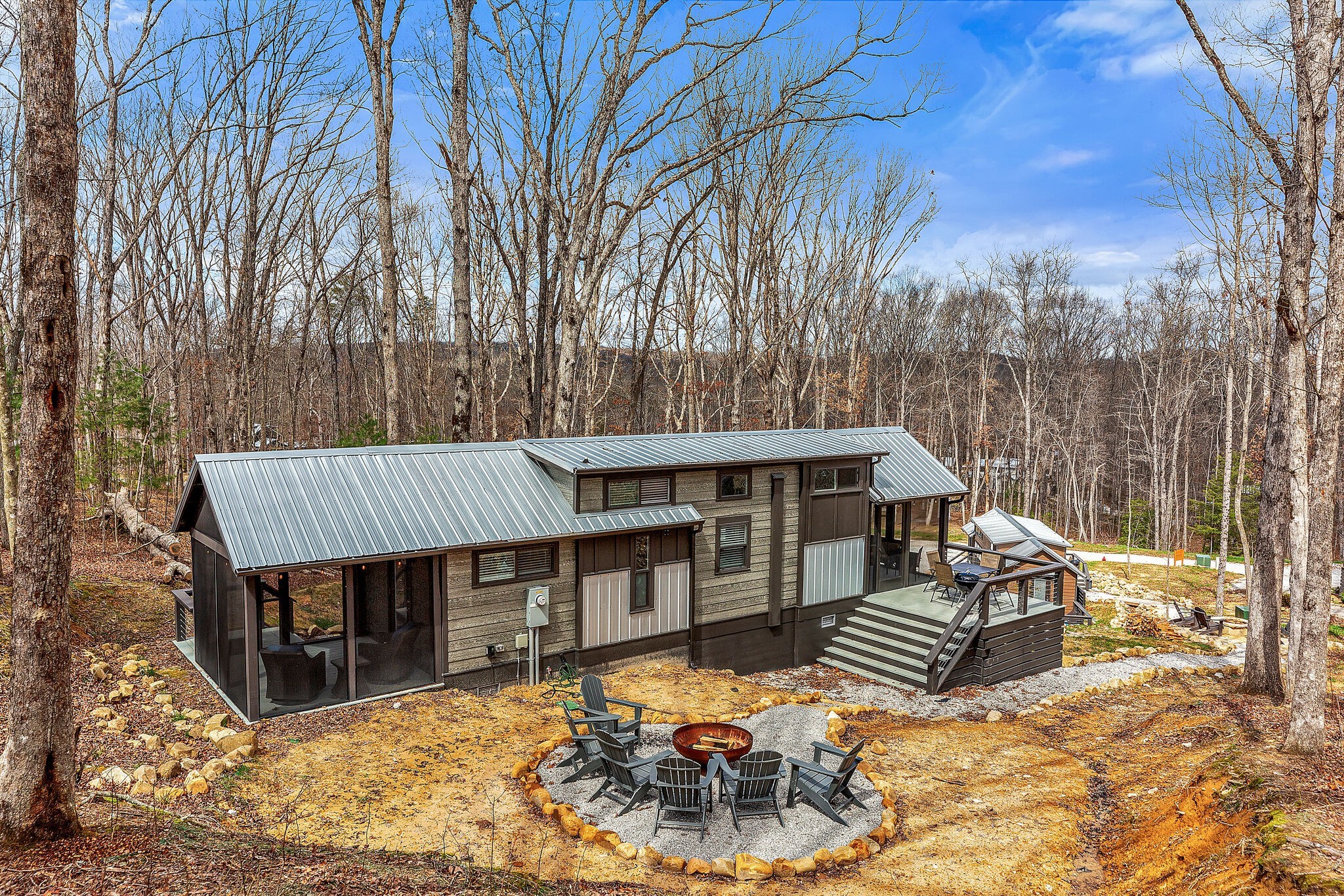 42 Oakleaf Trail Tracy City, TN 37387 - Photo 38 of 73 a view of a house with wooden deck and furniture