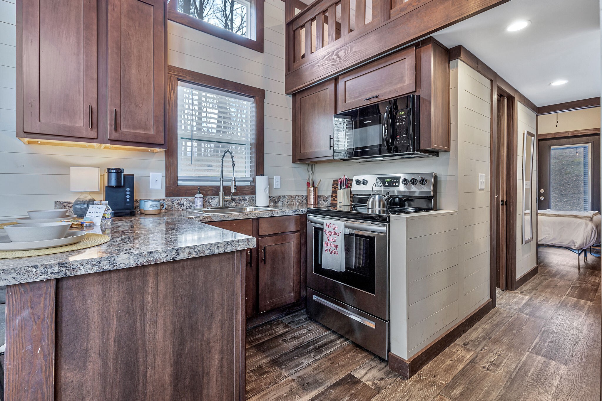 42 Oakleaf Trail Tracy City, TN 37387 - Photo 48 of 73 a kitchen with stainless steel appliances granite countertop a stove a sink and a microwave