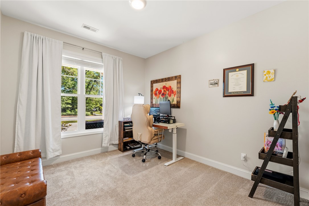 47 A Main Street Pelzer, SC 29669 - Photo 19 of 27 This versatile room offers ample natural light and a comfortable setting for work or relaxation.