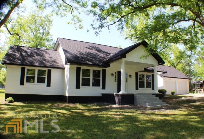440 Country Club Road Dublin, GA 31021 - Photo 1 of 1 a view of a house with a swimming pool