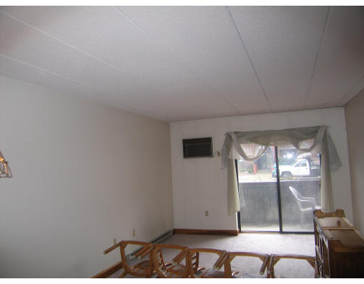 137 Franklin Street, Unit 102 Stoneham, MA 02180 - Photo 3 of 8 a view of an empty room and window