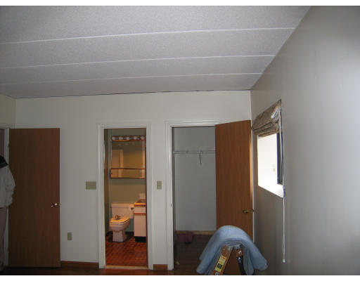 137 Franklin Street, Unit 102 Stoneham, MA 02180 - Photo 6 of 8 a view of hallway with stairs and wooden floor