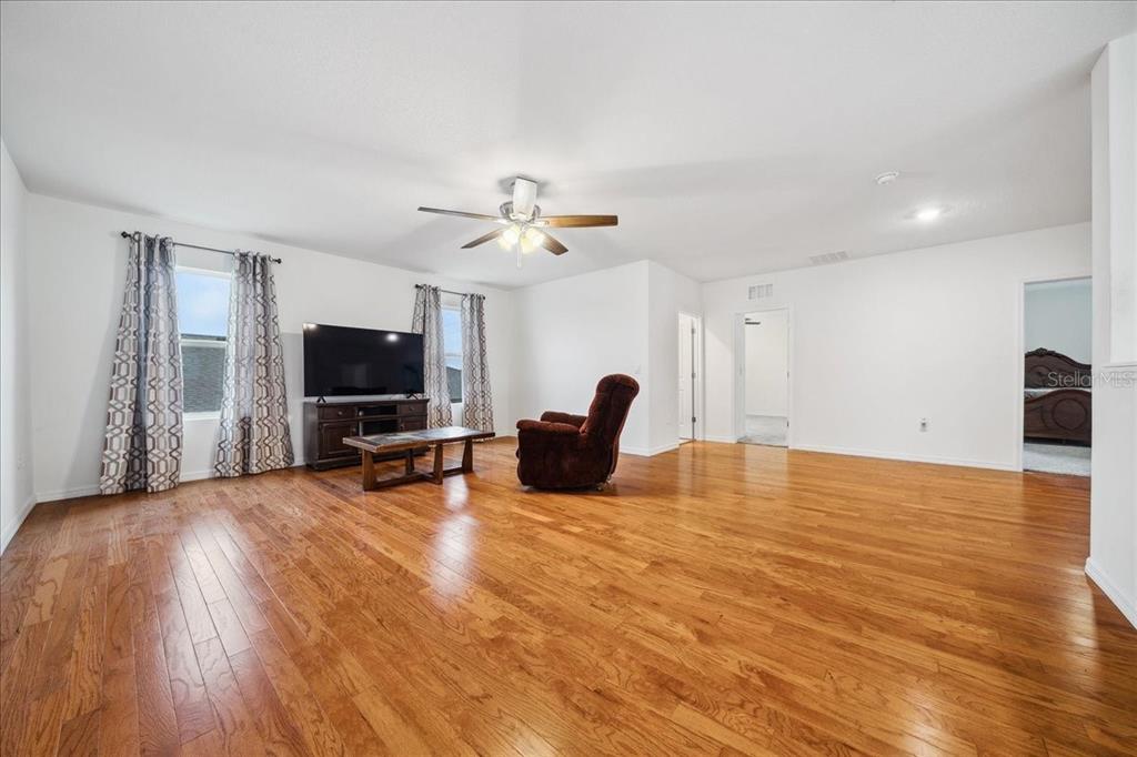 8110 Southwest 59th Terrace Ocala, FL 34476 - Photo 19 of 35 a view of a livingroom with furniture and a flat screen tv