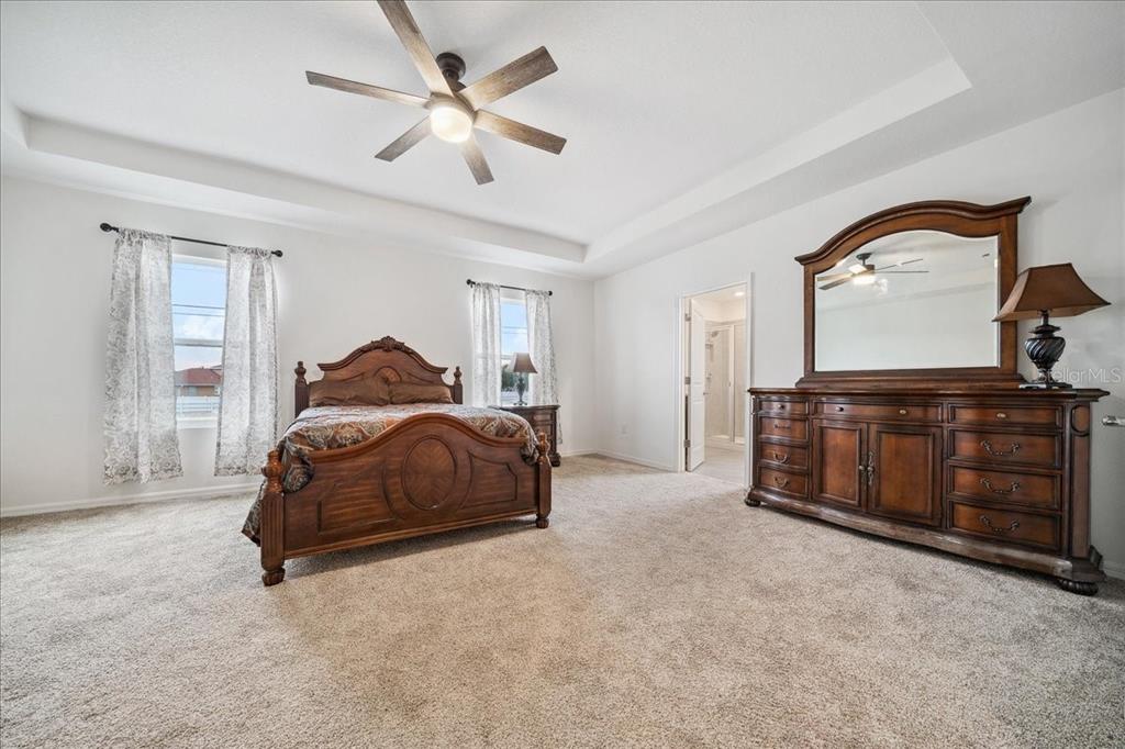 8110 Southwest 59th Terrace Ocala, FL 34476 - Photo 21 of 35 a bedroom with a bed and a dresser