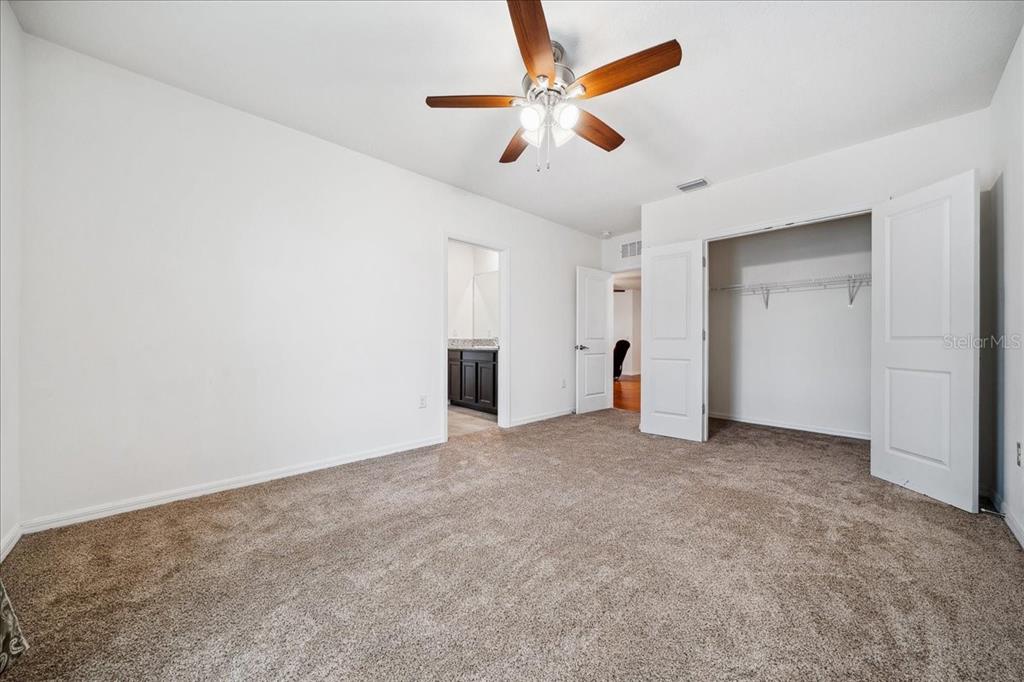 8110 Southwest 59th Terrace Ocala, FL 34476 - Photo 28 of 35 an empty room with closet and fan