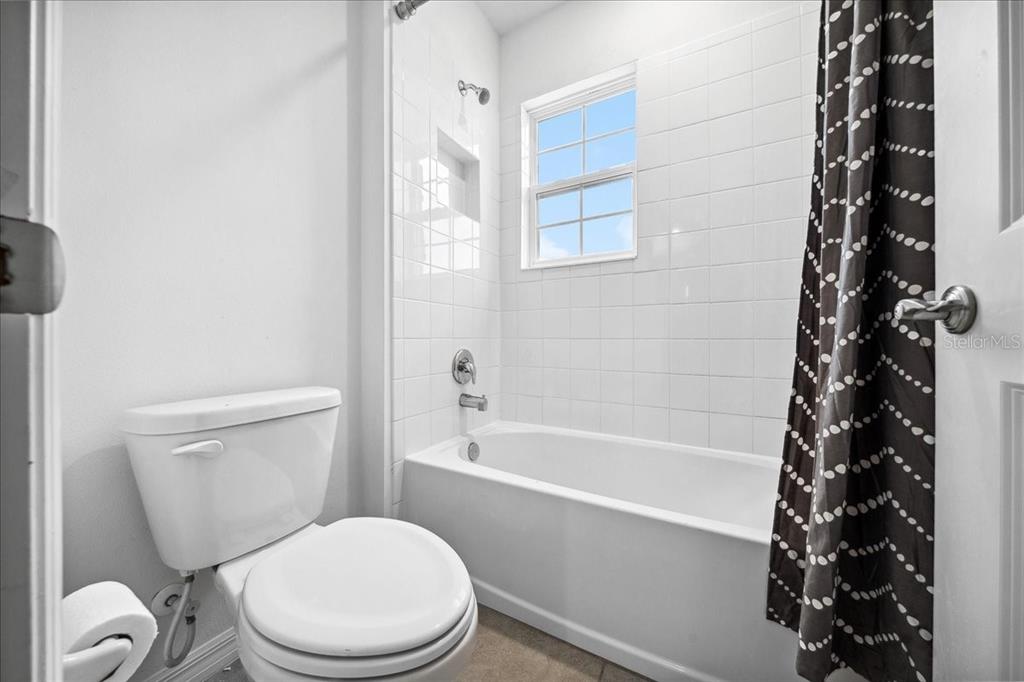 8110 Southwest 59th Terrace Ocala, FL 34476 - Photo 31 of 35 a white toilet sitting next to a bath tub