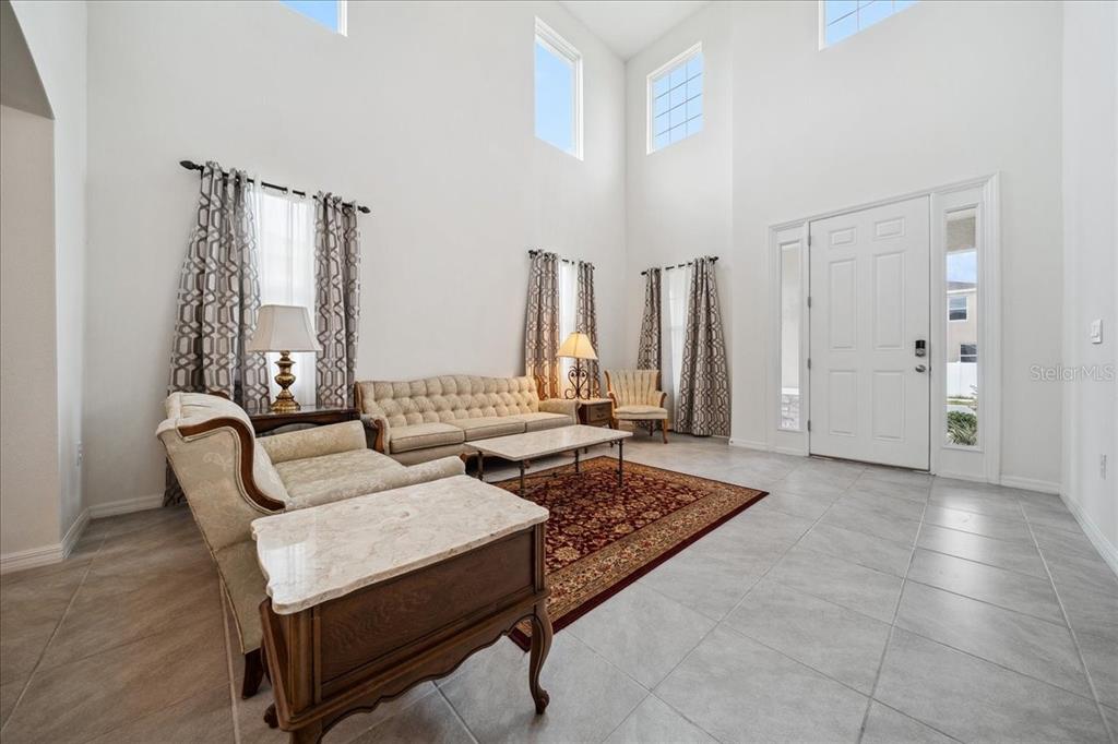 8110 Southwest 59th Terrace Ocala, FL 34476 - Photo 5 of 35 a living room with furniture and a rug