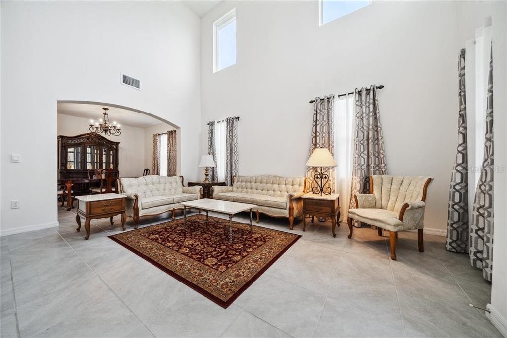 8110 Southwest 59th Terrace Ocala, FL 34476 - Photo 6 of 35 a living room with furniture and a rug
