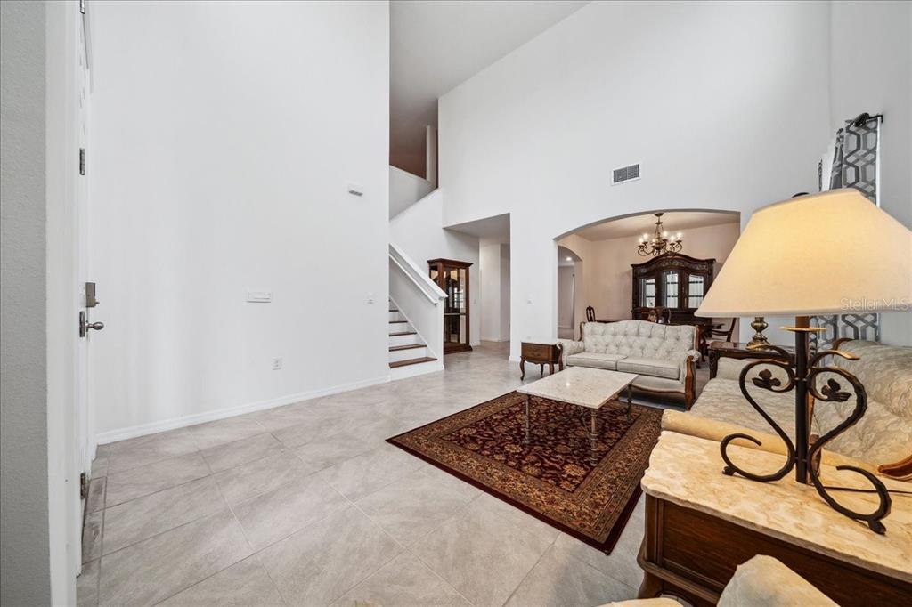 8110 Southwest 59th Terrace Ocala, FL 34476 - Photo 7 of 35 a view of a hallway with couch
